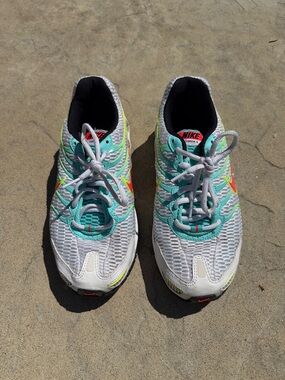 Nike White Running Shoes with Teal and Neon Accents